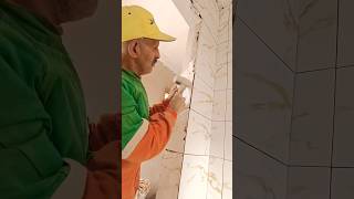 Step by step installing ceramic tiles on the wall of the bathroom door [upl. by Nitsraek468]