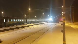 2TE116987 Baltijas Ekspresis with grain hoppers passing Aizkraukle station [upl. by Dloraj]