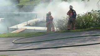 Video Firefighters battle boat fire at Owasco Marina [upl. by Halstead]