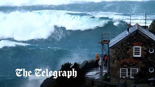 Storm Noa huge waves crash over Cornish coast as 90mph winds lash UK [upl. by Annaehs]