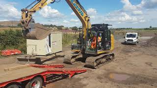 Loading excavator on to trailer [upl. by Adnilreb]