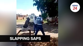 WATCH  SAPS vs slaps ‘Drunk’ man assaults cop after being warned to stop drinking in public [upl. by Damales]