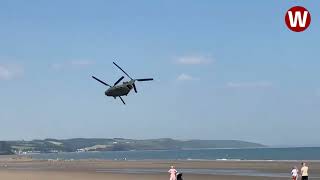 Moment lowflying Chinook helicopter thunders over Welsh beach [upl. by Dasie]