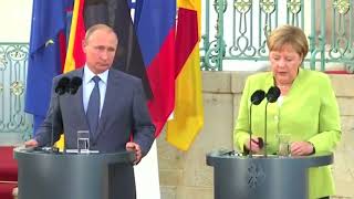 Merkel Putin tackle tough topics in meeting outside Berlin [upl. by Oiramd]