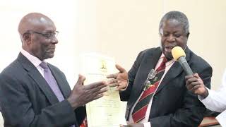 ProfJohn Asibo Opuda shaking hands with ProfNdorelire at the handover of the Charter document [upl. by Pallaton]