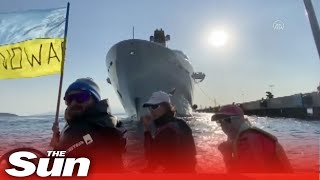 Ukraine protesters in a motor boat block Roman Abramovichs yacht from docking in Turkey [upl. by Lilybelle]