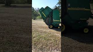 Hay coming out of John Deere Baler shorts [upl. by Kakalina]