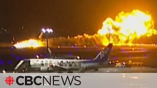 Video captures fiery crash between passenger plane and Japanese coast guard aircraft [upl. by Ardnaiek398]