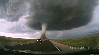 Storm chasing dashcam Tornado crossing the highway Laramie Wyoming [upl. by Vanessa880]