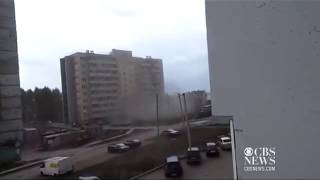 Crane crashes into apartment building in Russia [upl. by Pierson]