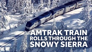 Amtrak Train Crawls through the Snowy Sierra Mountains in California [upl. by Peyter]