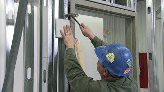 How to Install a Steel Door Frame in Steel Stud Construction  Steel Door Institute [upl. by Marquita]