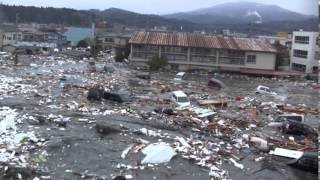 Tsunami in Kesennuma city ascending the Okawa river [upl. by Spears]