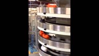 AmbaFlex Spiral Conveyor  Empty puck handling single file [upl. by Nahsor]