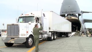 Watch A Gigantic C5 Galaxy Cargo Aircraft Swallows A Semi Truck [upl. by Aehta285]