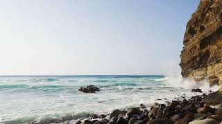 Sea cliff and white foam of waves [upl. by Clea]