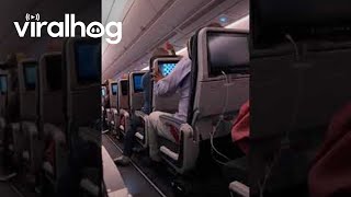 Airline Passenger Upset at Reclined Seat  ViralHog [upl. by Ahsirtap]