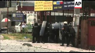 Riot police clash with squatters resisting demolition along major road in Manila [upl. by Atteuqahs]