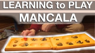 Learning how to play Mancala [upl. by Beckerman]