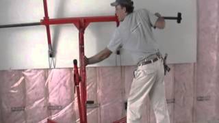 Installing drywall on upper walls with lift by Laurier Desormeaux [upl. by Snehpets]