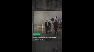 Citibank employee punches climate activist in the face [upl. by Camella903]