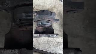 Unsticking a frozen brake caliper piston with grease gun the easy way [upl. by Ydnih]