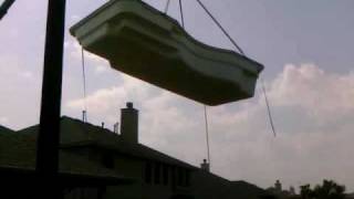 Crane moving pool from street and over house [upl. by Clarette348]