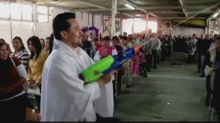 Mexican priest uses watergun to spray holy water [upl. by Burrow441]