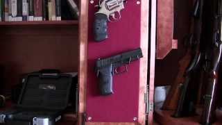 Hanging pistols inside gun cabinet [upl. by Atiuqal]