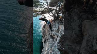 Person does a double layout from a beautiful 15m cliff in Croatia [upl. by Katinka724]