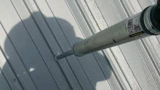 Sealing screwheads and nailheads on metal roof [upl. by Natye]