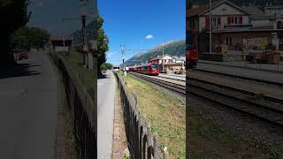 Two Rhaetian Railway trains in CelerinaSchlarigna railway station Engadin Switzerland [upl. by Ansell]