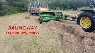 Square Baling Hay  Extreme Windrows  JD 5055D 348 Baler amp 42 Pan Kicker [upl. by Stefanac955]